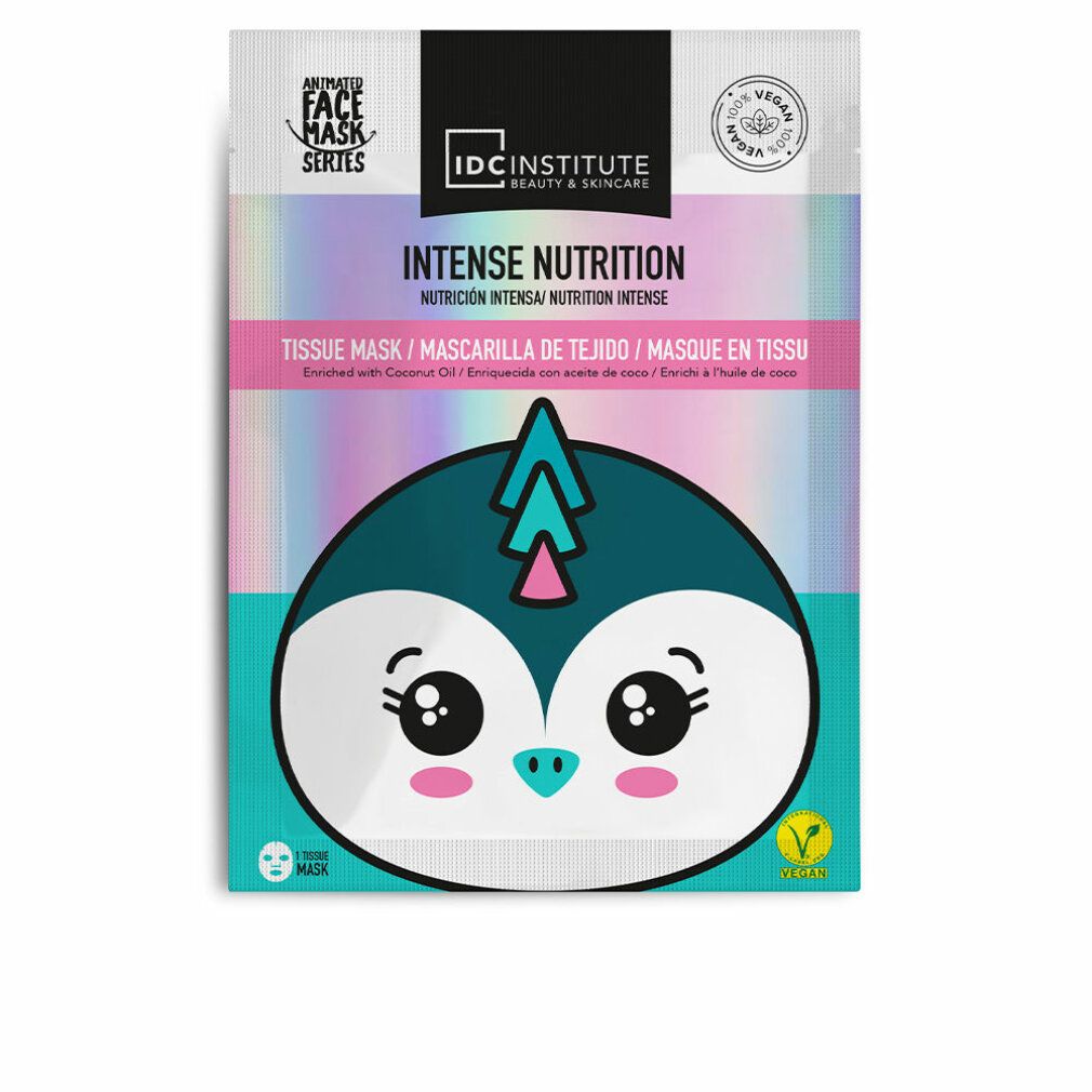 Gesichtsmaske mit Pinguin-Design. Verpackung mit Aufschrift 'Intense Nutrition' und 'Vegan'.