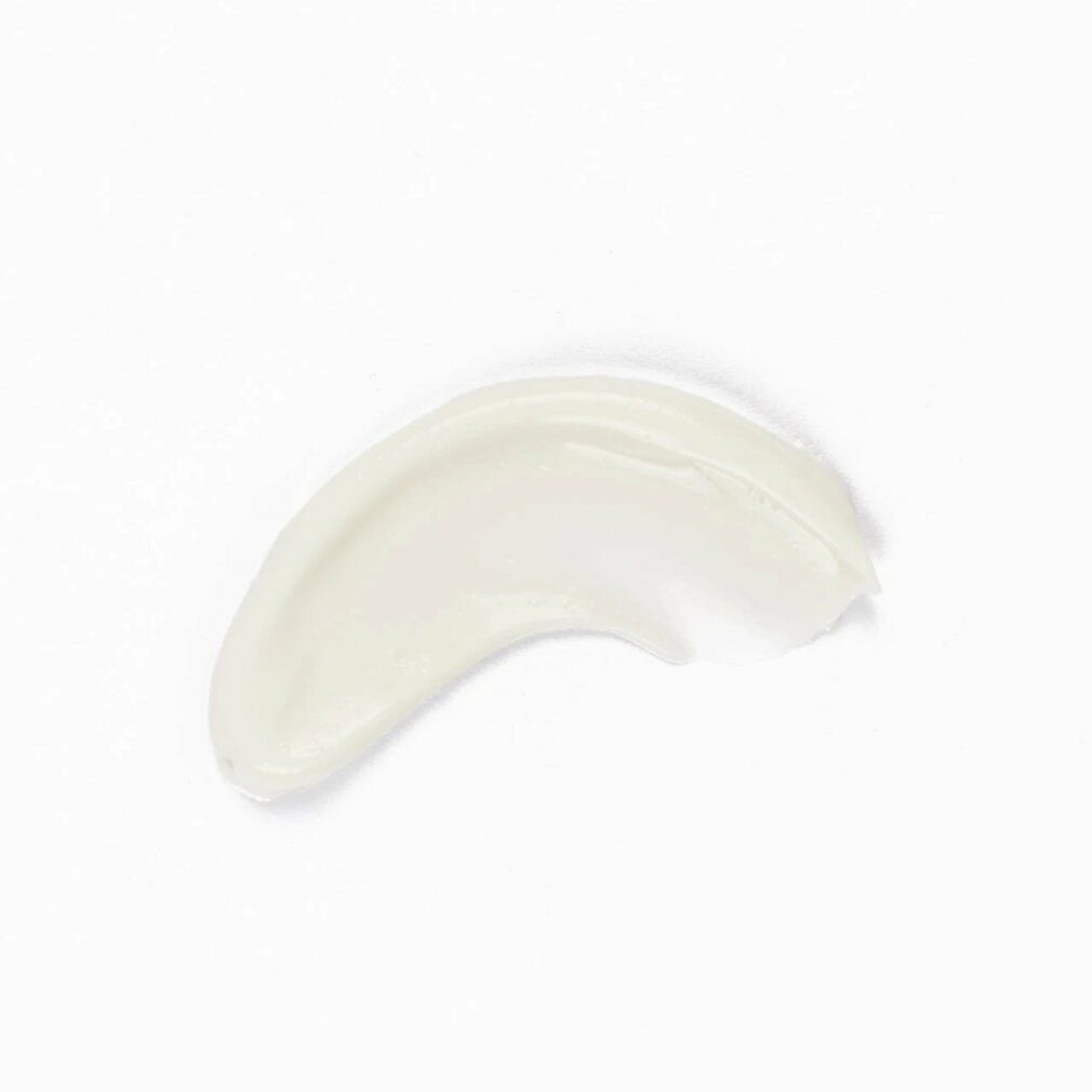 Ausgestrichene, cremefarbene Creme auf weißem Hintergrund. Form: gebogen.