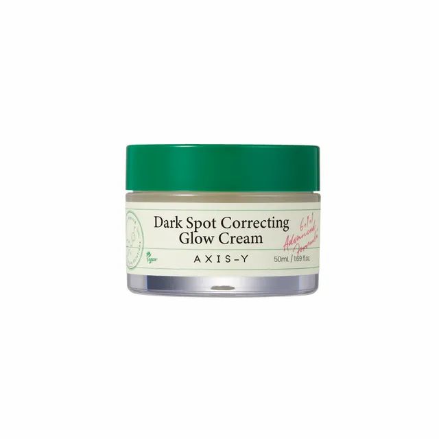 AXIS-Y Dark Spot Correcting Glow Cream in einem Glasbehälter mit grünem Deckel.