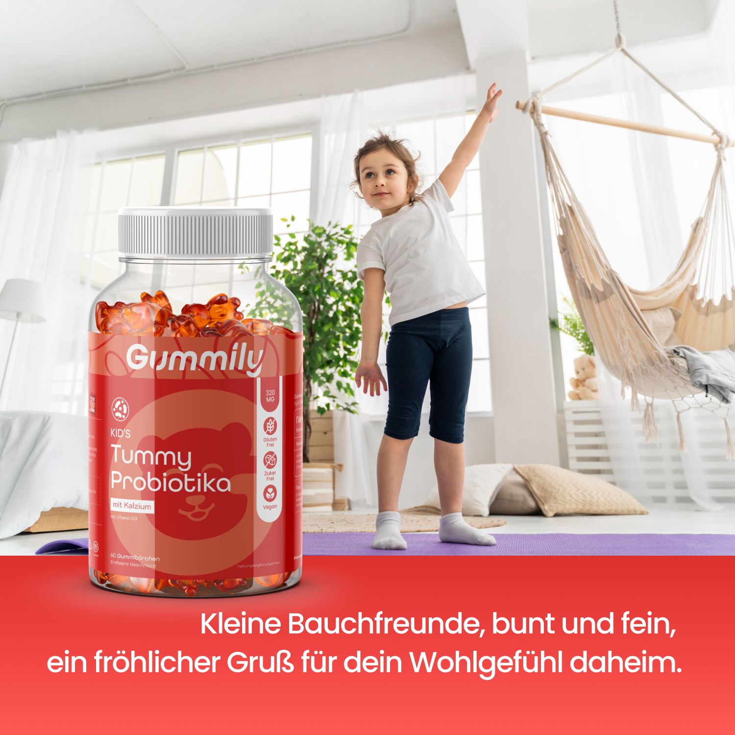 Kind steht neben einem Behälter Gummily Kinder Tummy Probiotika in einem hellen Raum.