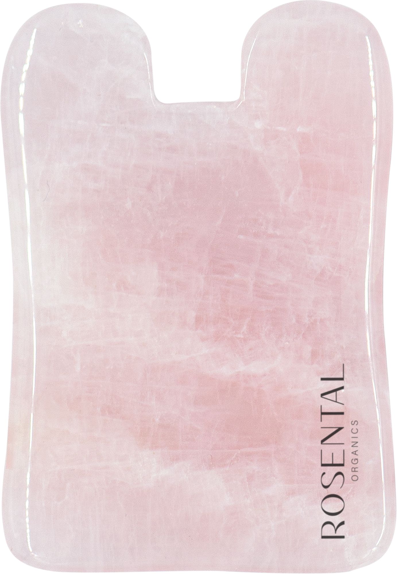 Gua Sha aus Rosenquarz. Rosa Stein, abgerundete Form mit zwei Aussparungen. Text: Rosental Organics.