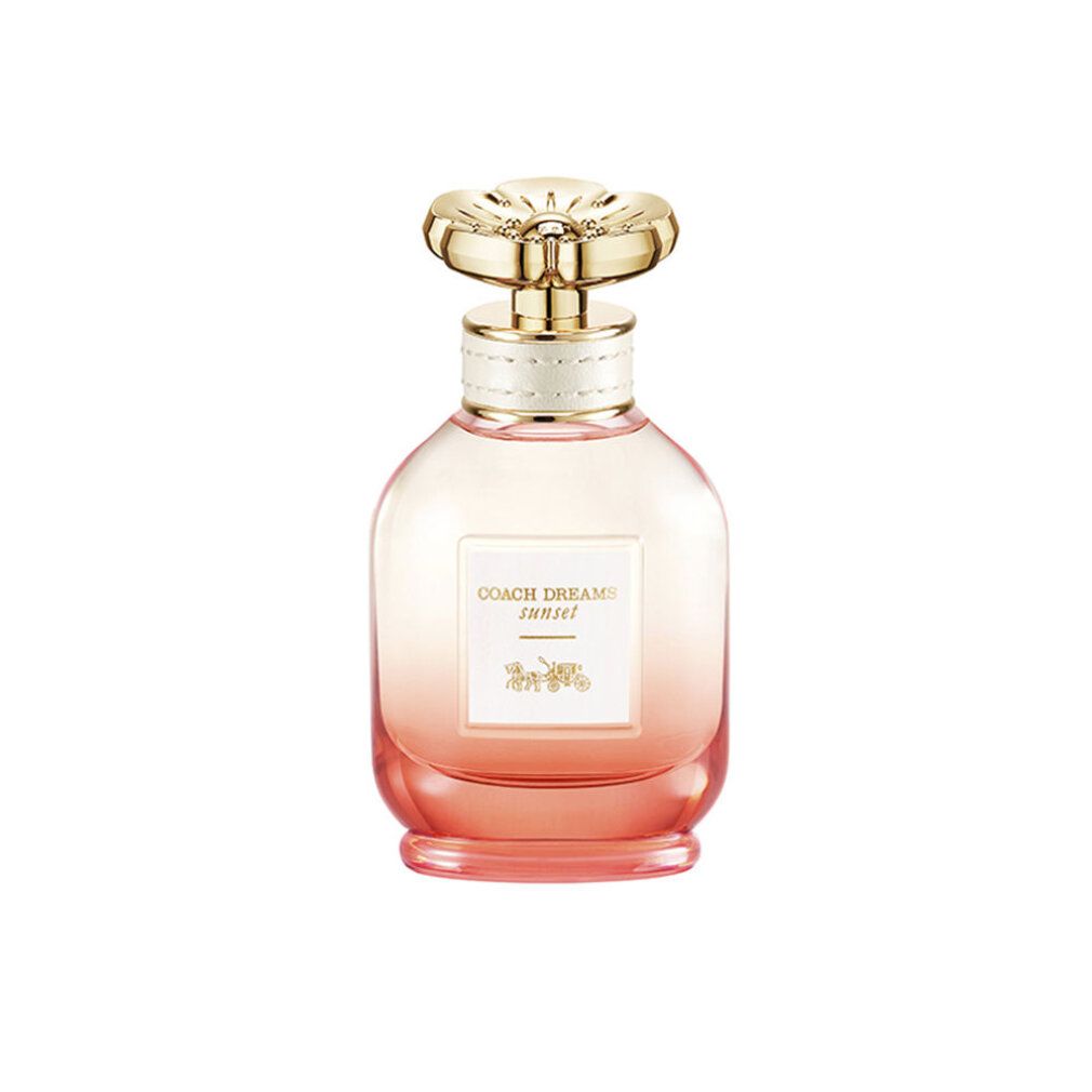 Parfümflakon mit goldfarbenem Deckel. Aufkleber mit "COACH DREAMS sunset". Farbverlauf von rosa nach orange. Floral geformter Deckel.