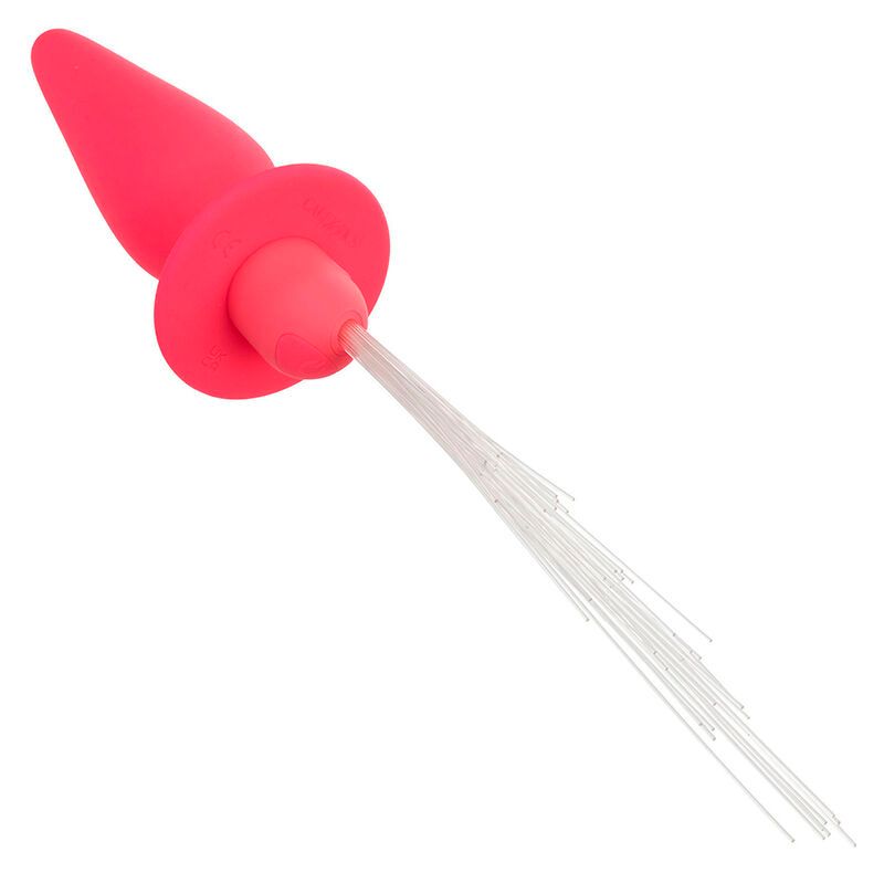 Pinkfarbener Analplug aus Silikon. Kegelförmiger Schaft, runder Flansch. Weiße Lichtfasern am Ende.