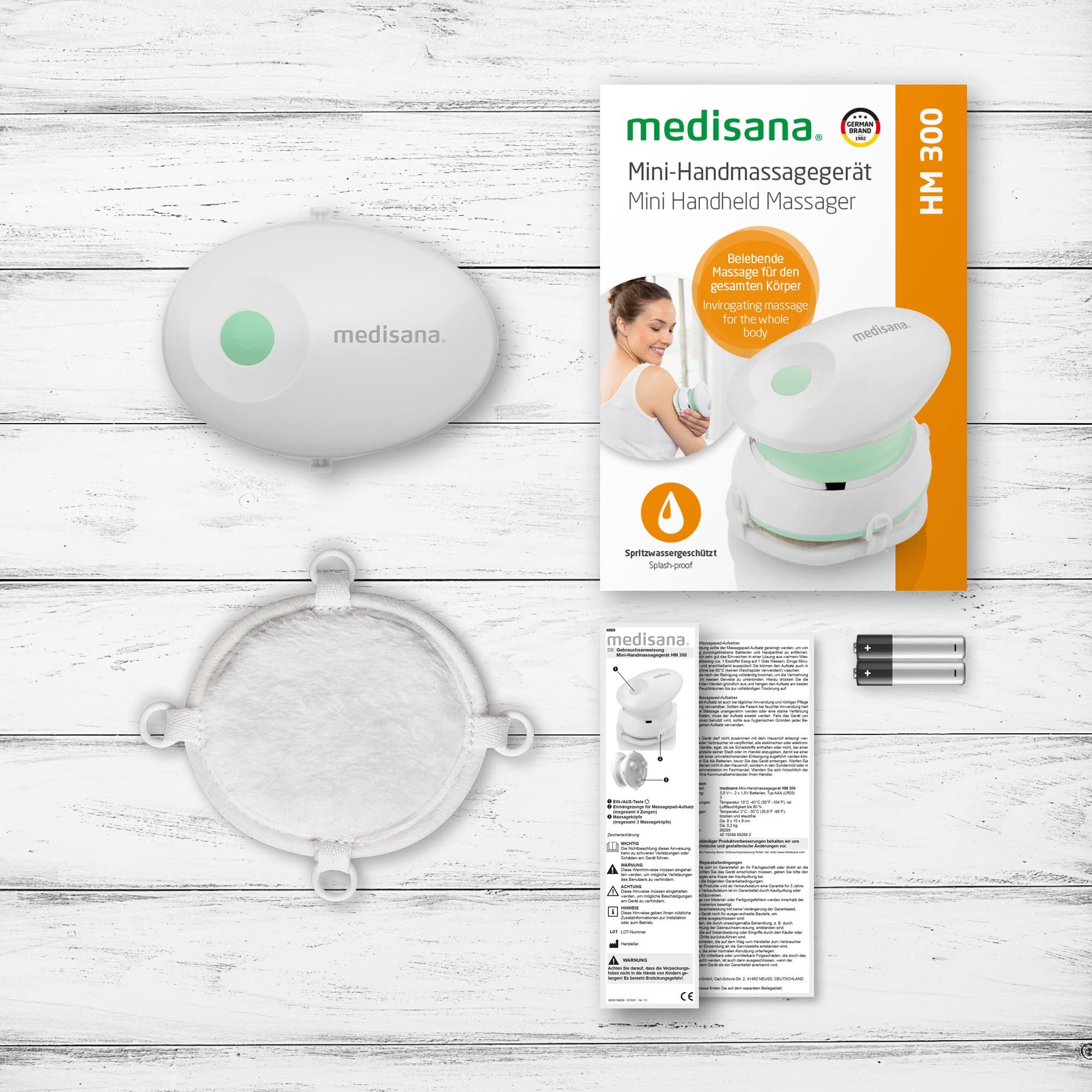 Medisana HM 300 Mini-Handmassagegerät und Zubehör im Lieferumfang.