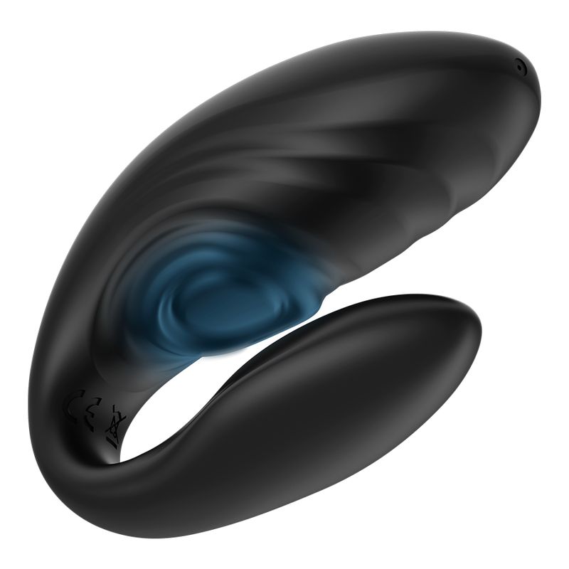 Schwarzer Paarvibrator mit geschwungener Form. Ein blaues, kreisförmiges Element ist sichtbar. Das Gerät hat eine glatte Oberfläche.