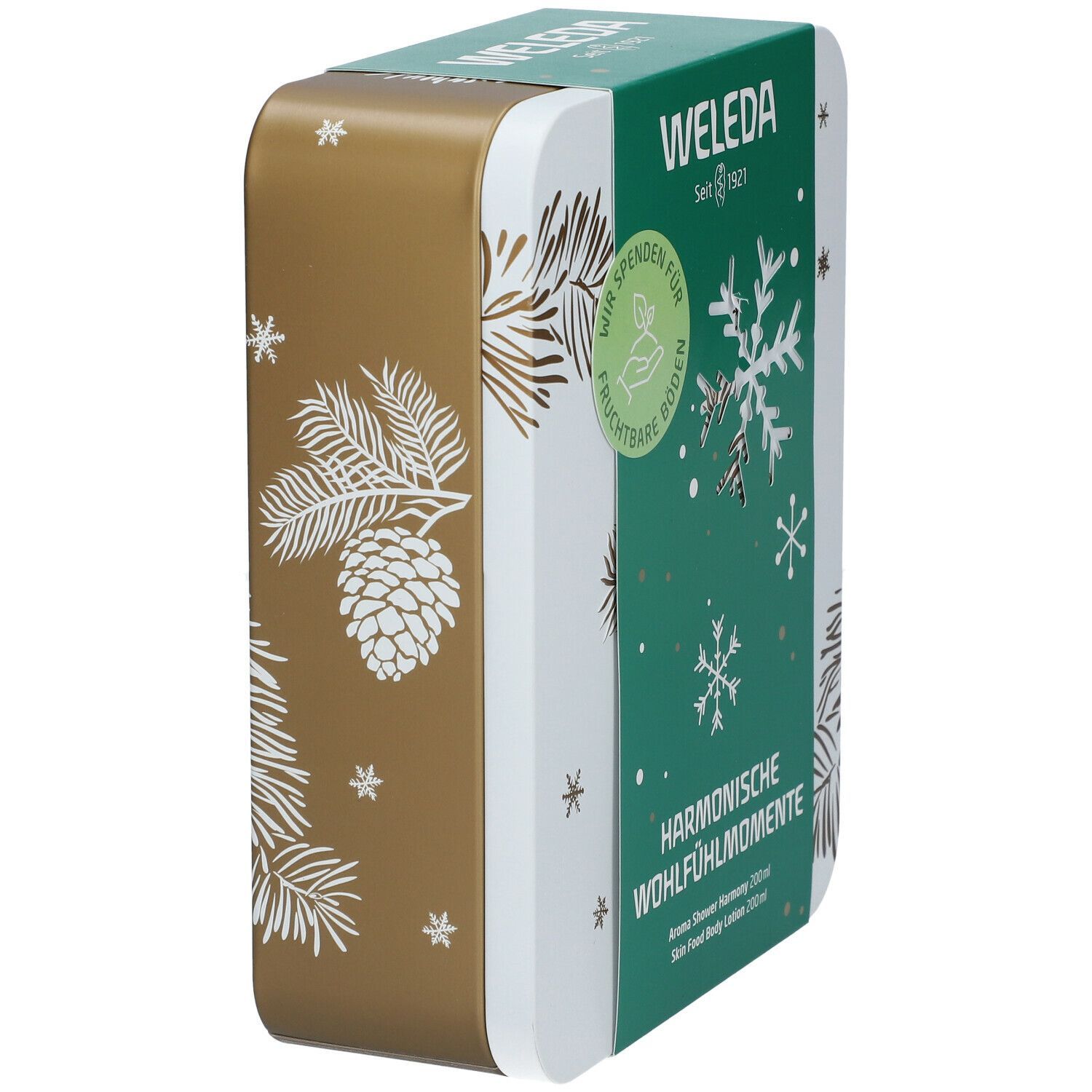Geschenkset-Box, goldfarben und weiß. Grüner Deckel mit Weleda-Logo und Text. Schneeflocken-Design. Abgerundete Ecken.