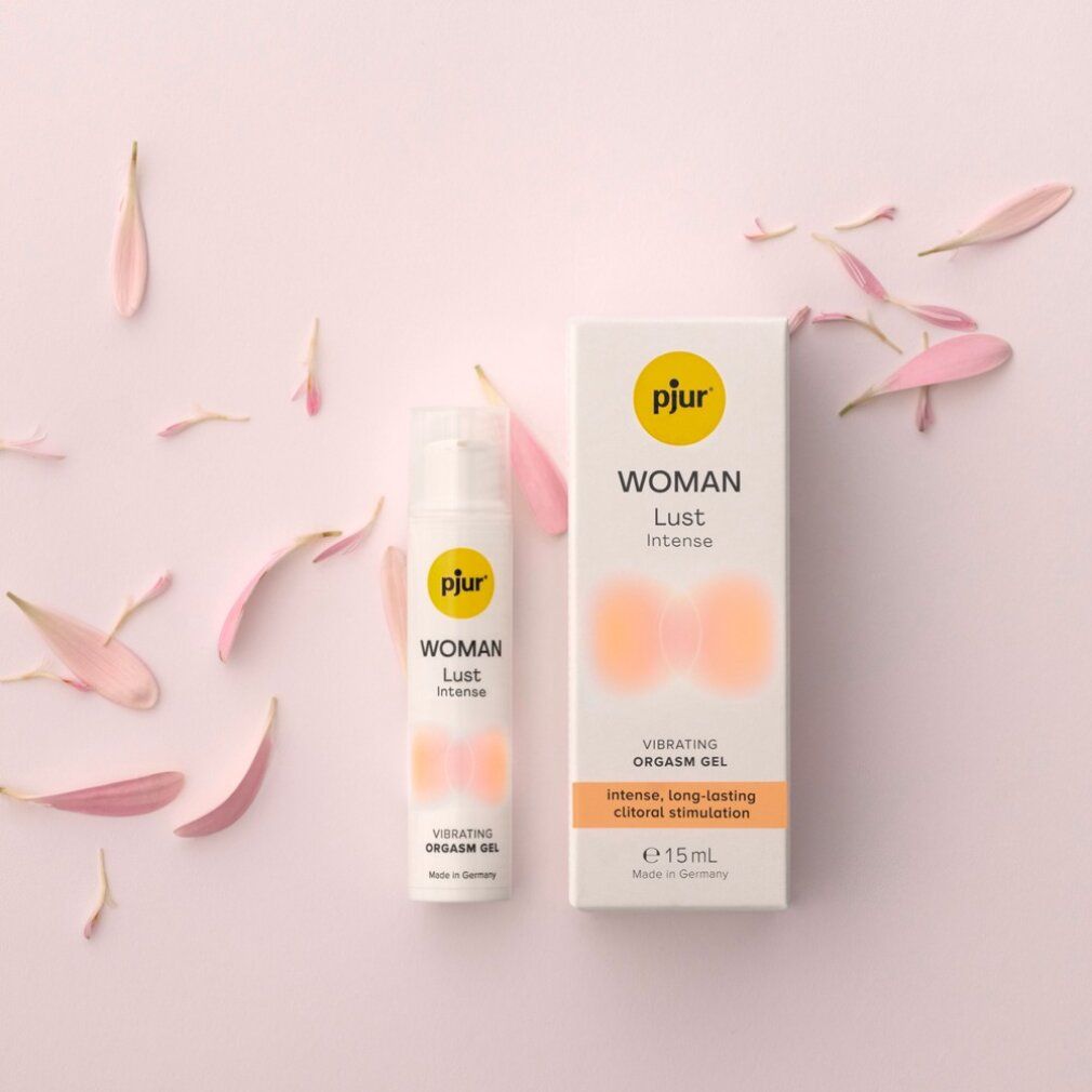 Produktverpackung und Flasche mit Blütenblättern. Text: WOMAN Lust Intense, Vibrating Orgasm Gel, intense, long-lasting clitoral stimulation, 15ml, Made in Germany.