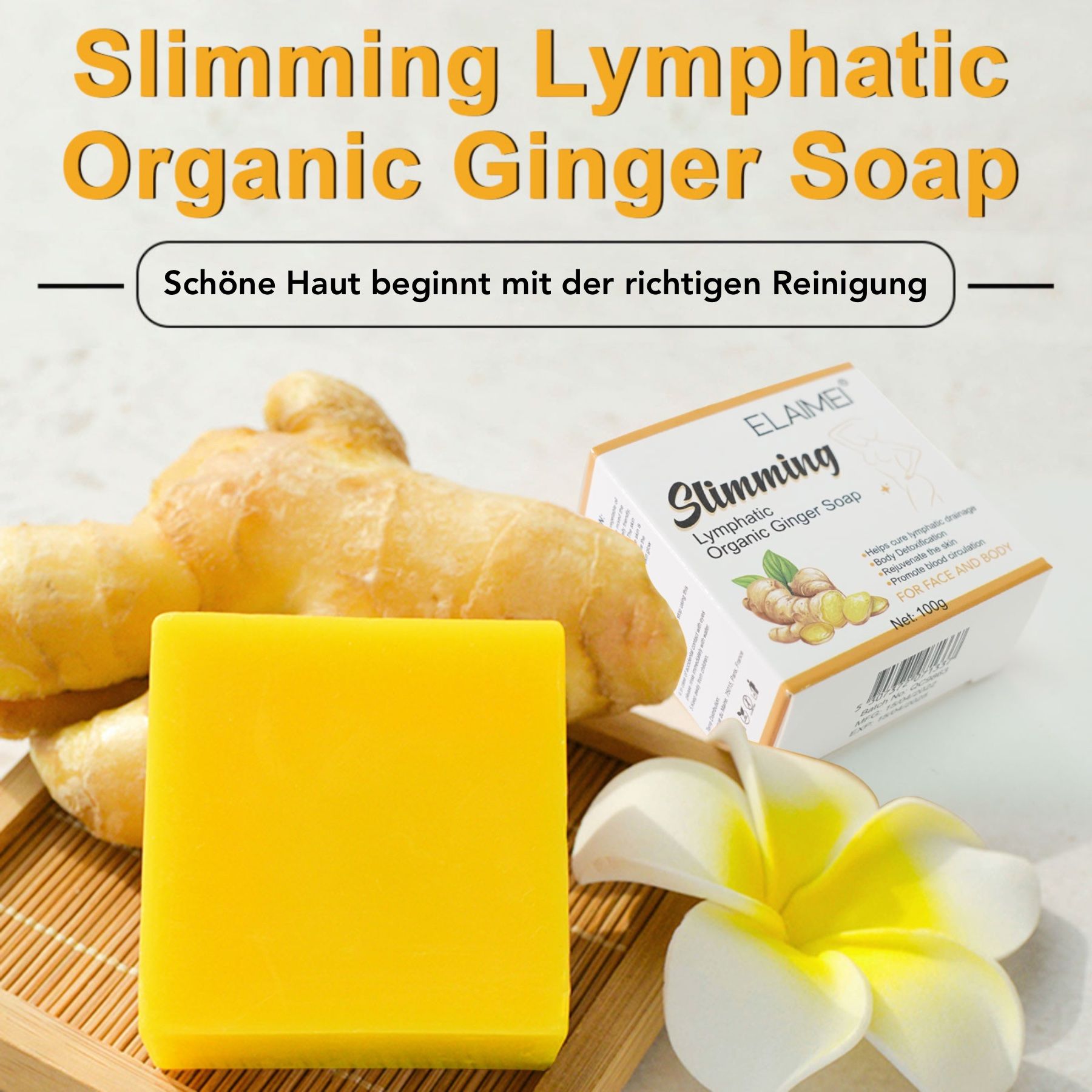 Gelbes Seifenstück, Ingwer und Verpackung. Aufschrift: Slimming Lymphatic Organic Ginger Soap. Marke: ELAIMEI. Auf Holzbrett.
