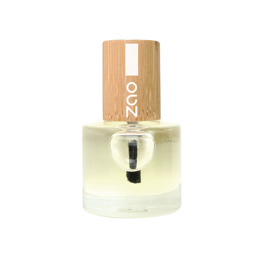 Glasflasche mit Holzdeckel. Deckel mit weißem Streifen und Schriftzug ZAO. Durchsichtige Flüssigkeit und Pinsel sichtbar.