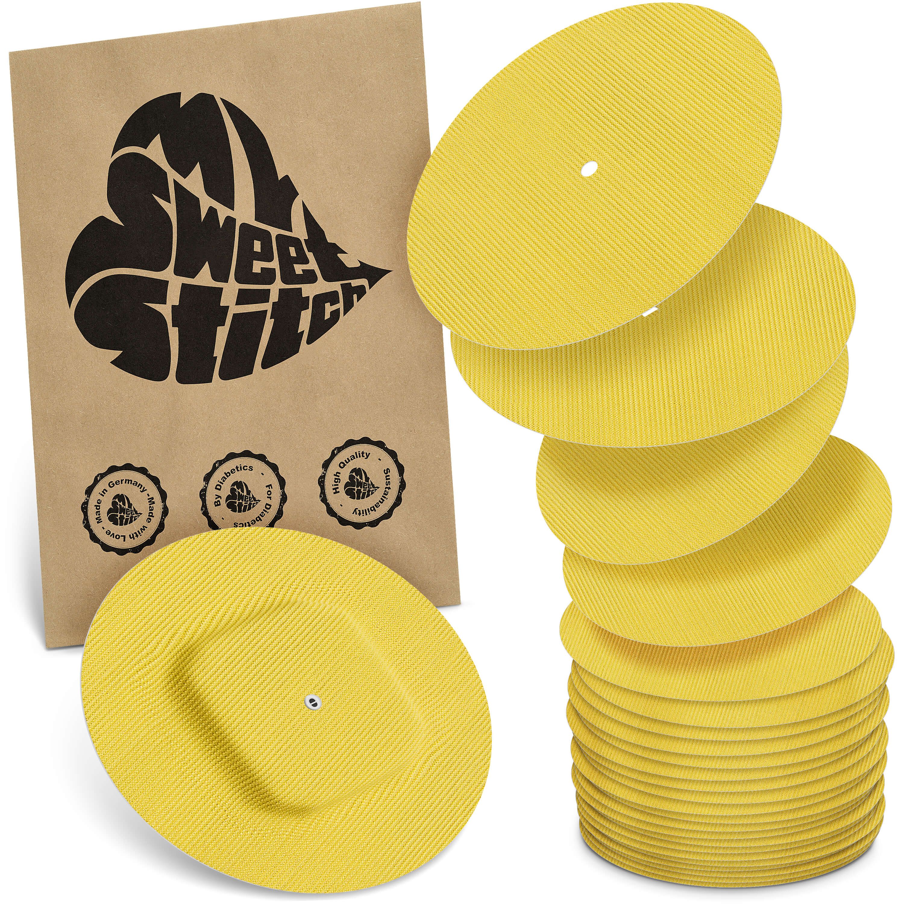 Gelbe, runde Pflaster mit geriffelter Oberfläche. Eine Packung mit Logo und Siegeln. Stapel von Pflastern.