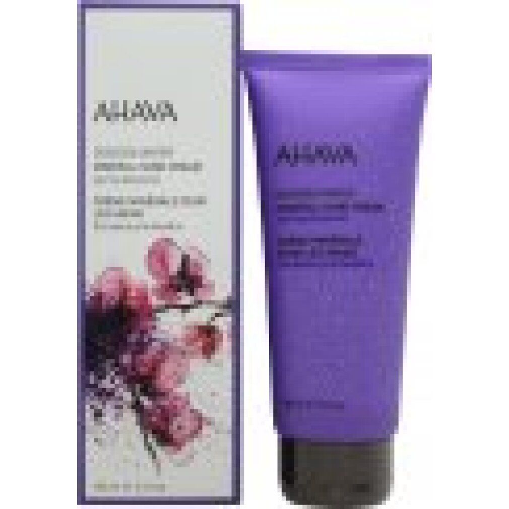 Lila Tube und Schachtel. AHAVA Mineral Hand Cream Spring Blossom. Blüten-Design. Schwarzer Deckel. Text auf Verpackung.