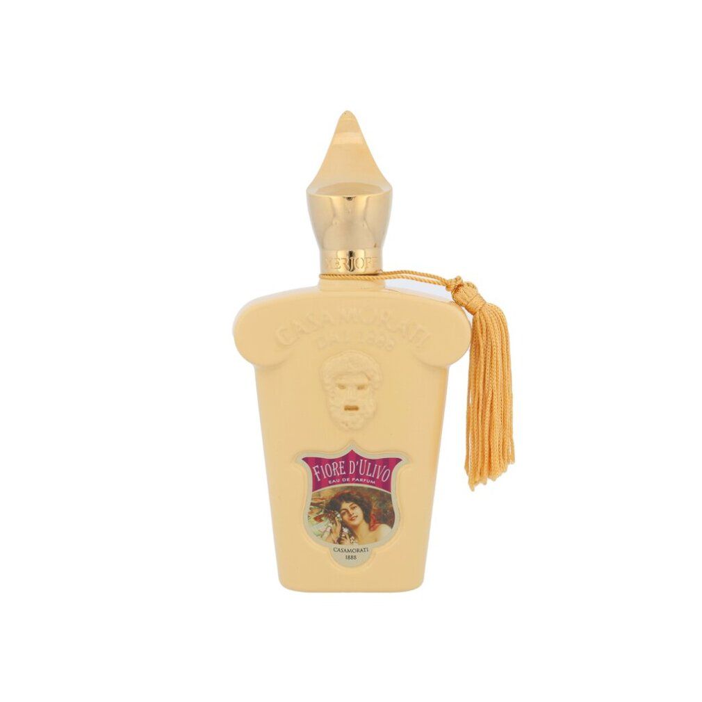 Beige Parfümflakon mit goldfarbenem Verschluss und Quaste. Aufschrift Fiore d'Ulivo und Casamorati.