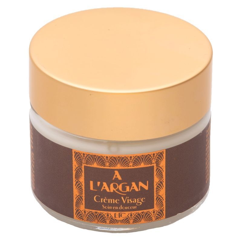 Runder Tiegel mit goldfarbenem Deckel. Auf dem braunen Etikett steht "A L'ARGAN Crème Visage".
