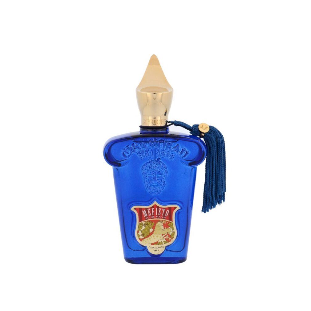 Blaue Glasflasche mit goldfarbenem Verschluss und Quaste. Aufschrift Mefisto auf dem Etikett.