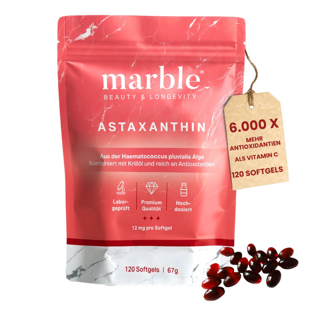 Rote Softgel-Kapseln und Verpackung. Text: marble Astaxanthin, 120 Softgels. Anhänger: 6.000X mehr Antioxidantien als Vitamin C.