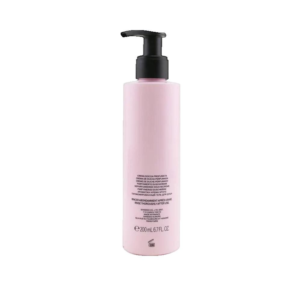 Rosa Flasche mit schwarzem Pumpkopf. Aufschrift: Creme de Douche Parfumée. Text auf der Rückseite.