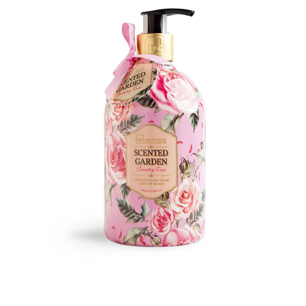 Rosa-Handseife mit Blumendekor. Flasche mit Dosierpumpe und Anhänger. Aufschrift: Scented Garden Country Rose. Marke: IDC INSTITUTE.