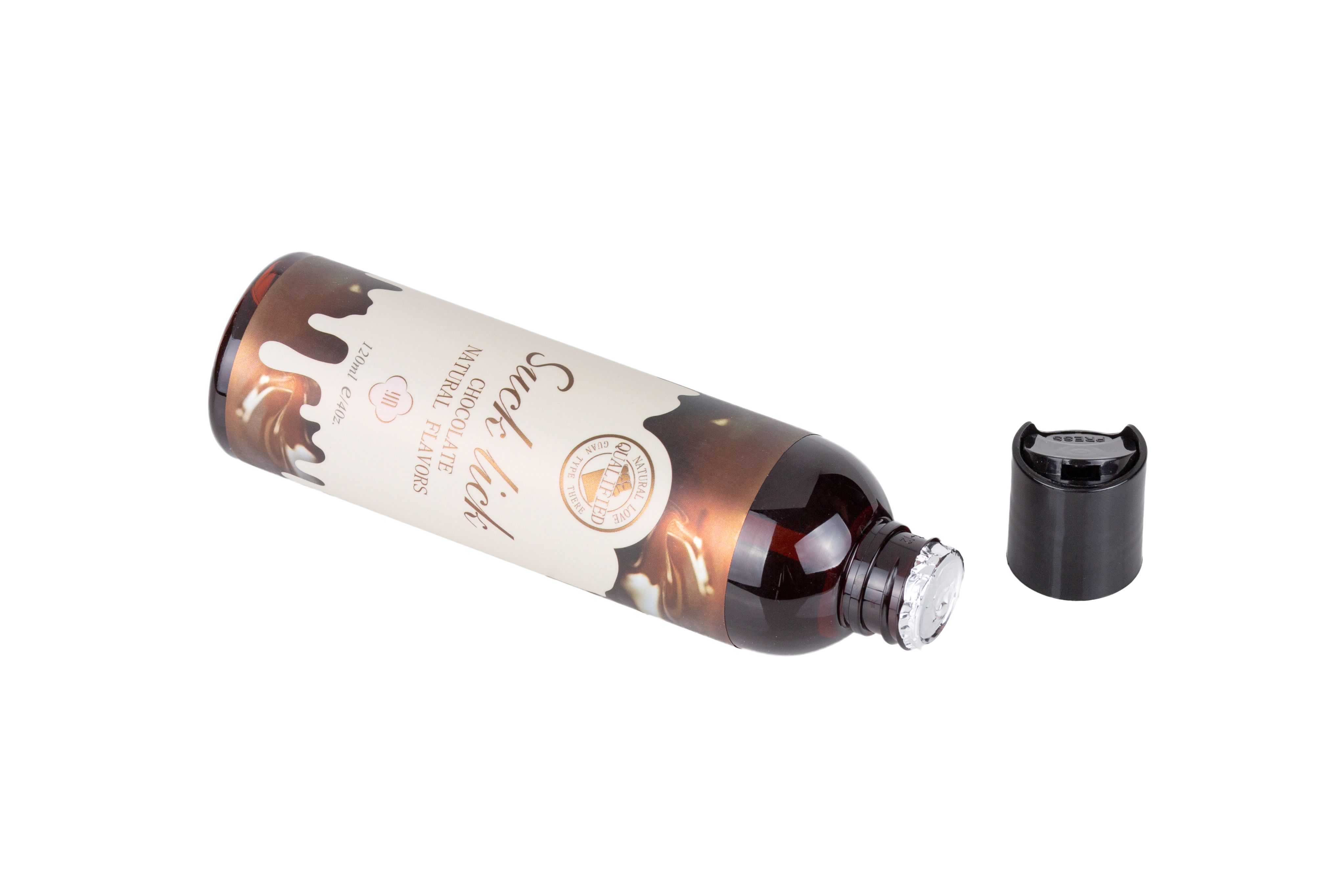 Braune Flasche mit schwarzem Deckel. Aufschrift: "Suck lick", "Chocolate Natural Flavors". Deckel daneben.