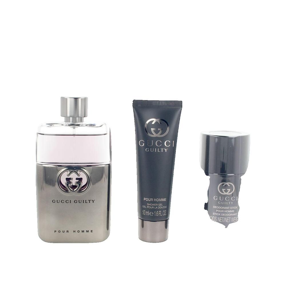 Drei Kosmetikprodukte: Flakon, Tube und Deodorant-Stick. Alle mit Logo und Schriftzug Gucci Guilty Pour Homme.