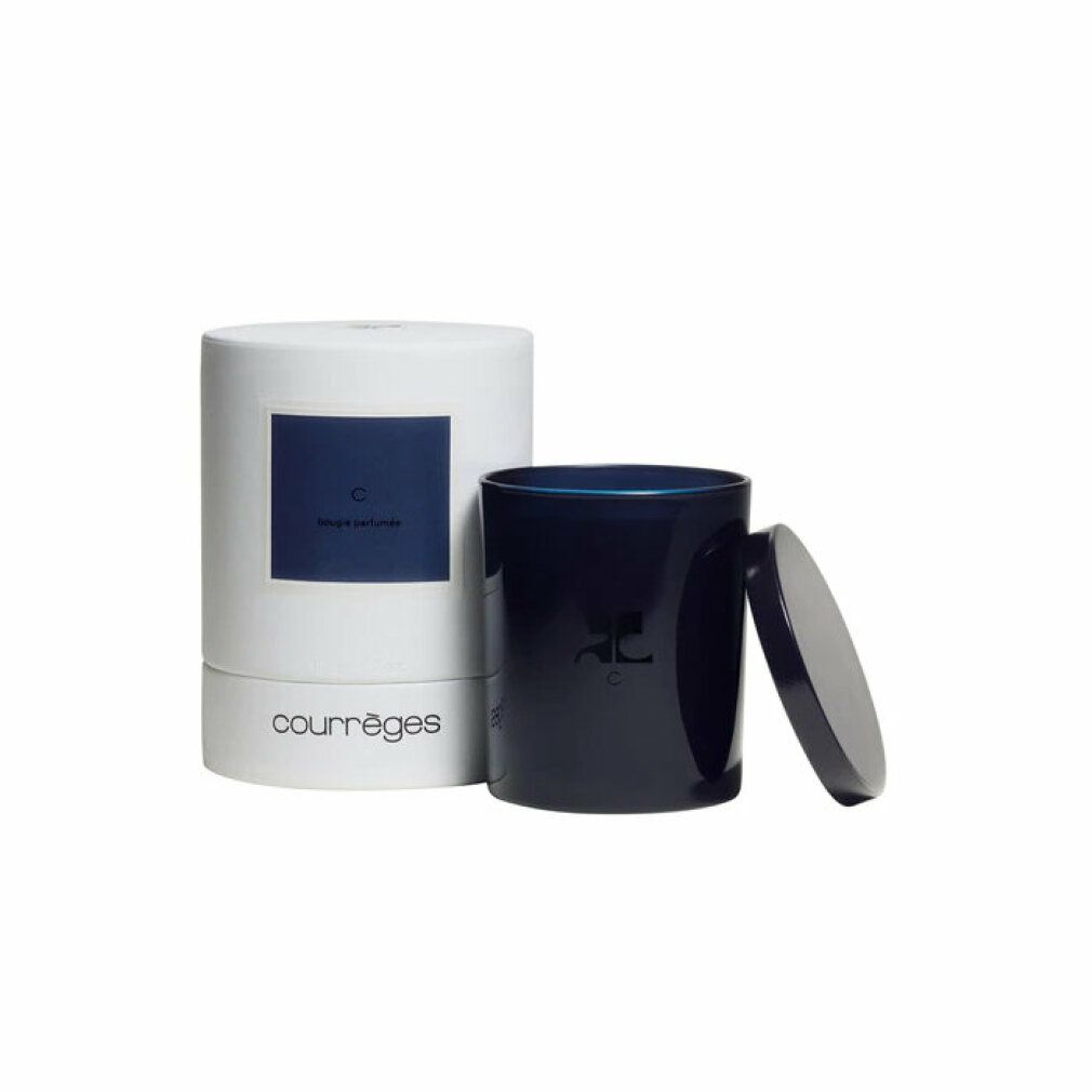 Dunkelblaue Kerze mit Deckel und weißer Verpackung. Aufschrift "Courrèges".