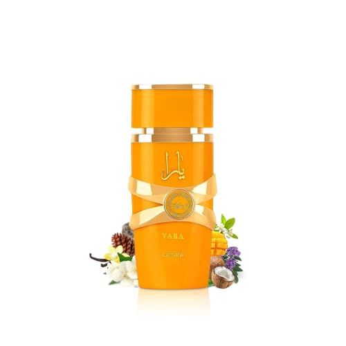 Gelbes Parfum Yara Tous, umgeben von Früchten und Blüten. Goldfarbene Akzente. Flakon mit arabischer Schrift.