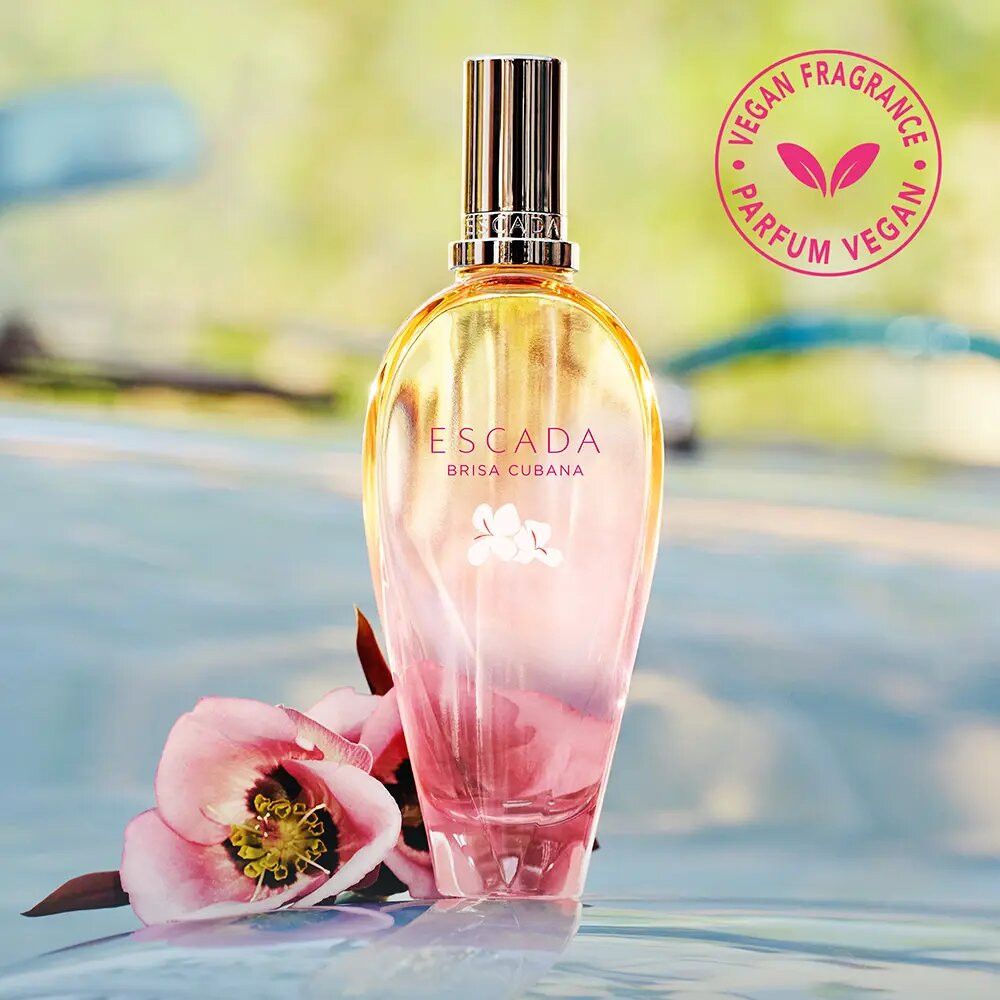 Escada Brisa Cubana EdT Nat. Spray. Flakon mit gelb-rosa Farbverlauf, silberner Verschluss. Vegan-Siegel.