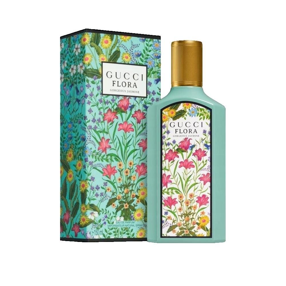 Türkisgrüner Flakon und Schachtel mit floralem Muster. Aufschrift Gucci Flora Gorgeous Jasmine. Goldfarbener Deckel.