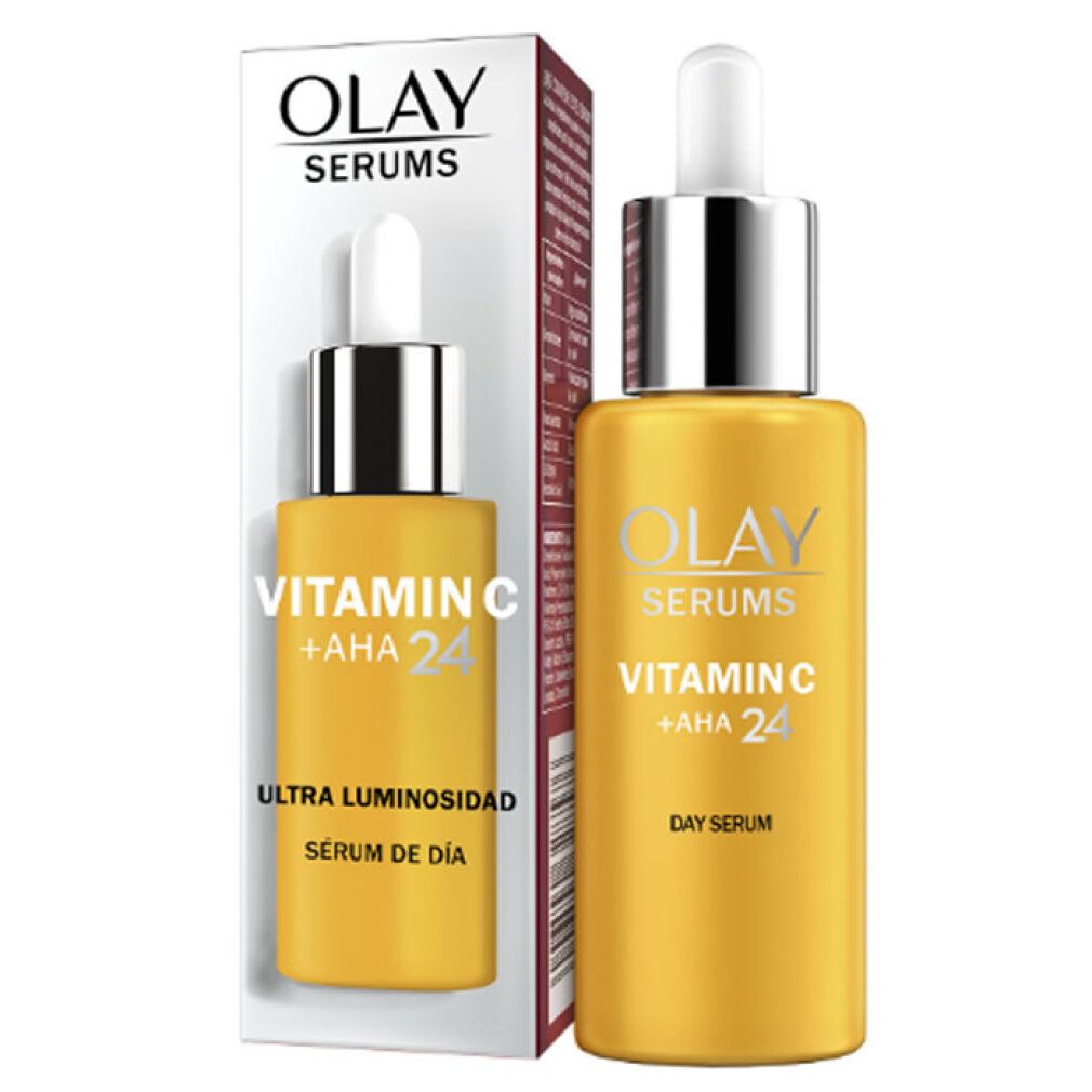 Gelbe Flasche mit Verpackung. Aufschrift: Olay Serums Vitamin C + AHA 24. Verpackung mit Aufschrift: Ultra Luminosidad.