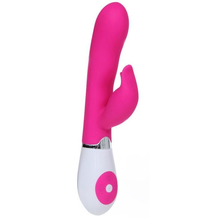 Pinkfarbener Vibrator mit gebogener Form und seitlichem Element. Weißer Griff mit Knopf. Silberfarbener Ring.