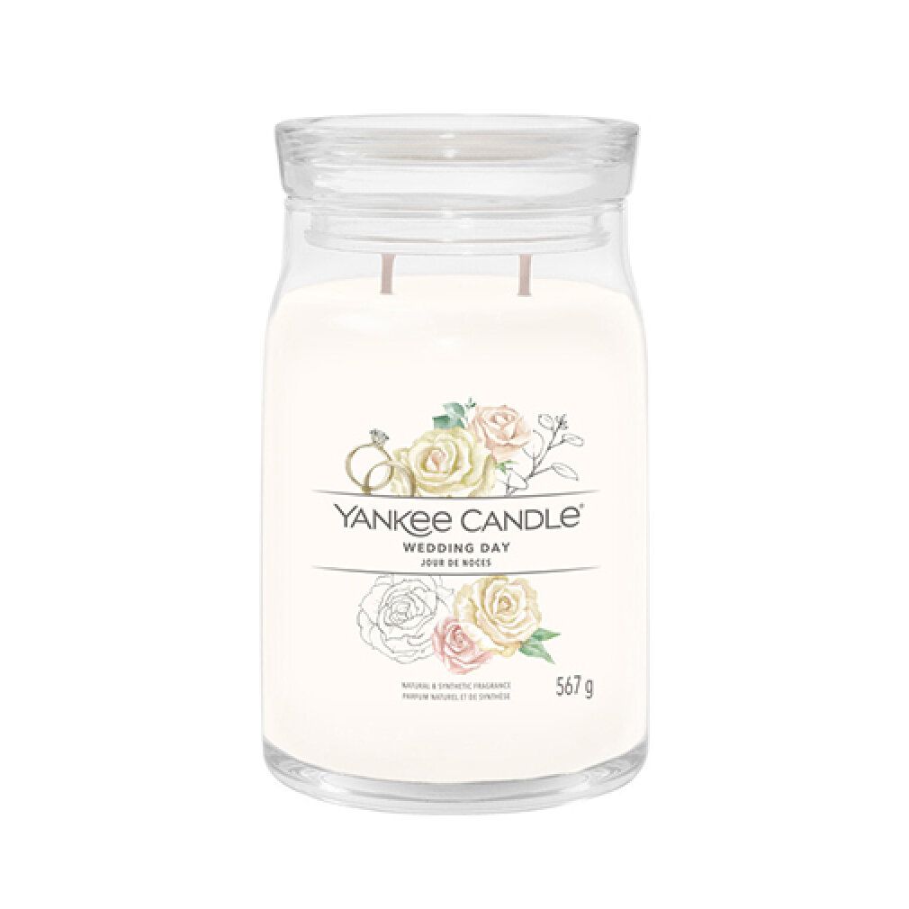 Glasbehälter mit Deckel, cremefarbenem Inhalt und Aufkleber. Aufschrift: Yankee Candle, Wedding Day, 567 g.