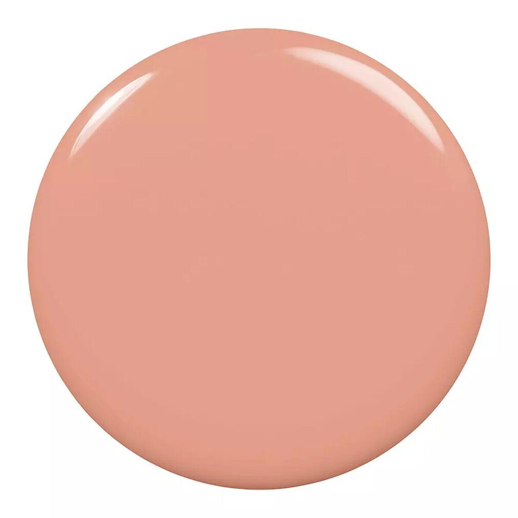 Runder, glänzender Nagellack-Fleck in Rosa-Beige. Keine Verpackung oder Flasche sichtbar.
