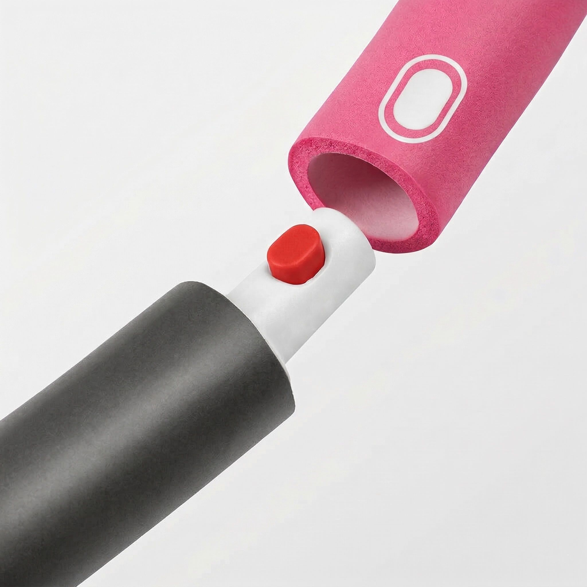 Nahaufnahme von zwei Hula-Hoop-Segmenten. Schwarzes und rosa Segment. Roter Knopf zum Verbinden. Weißes Verbindungsteil.