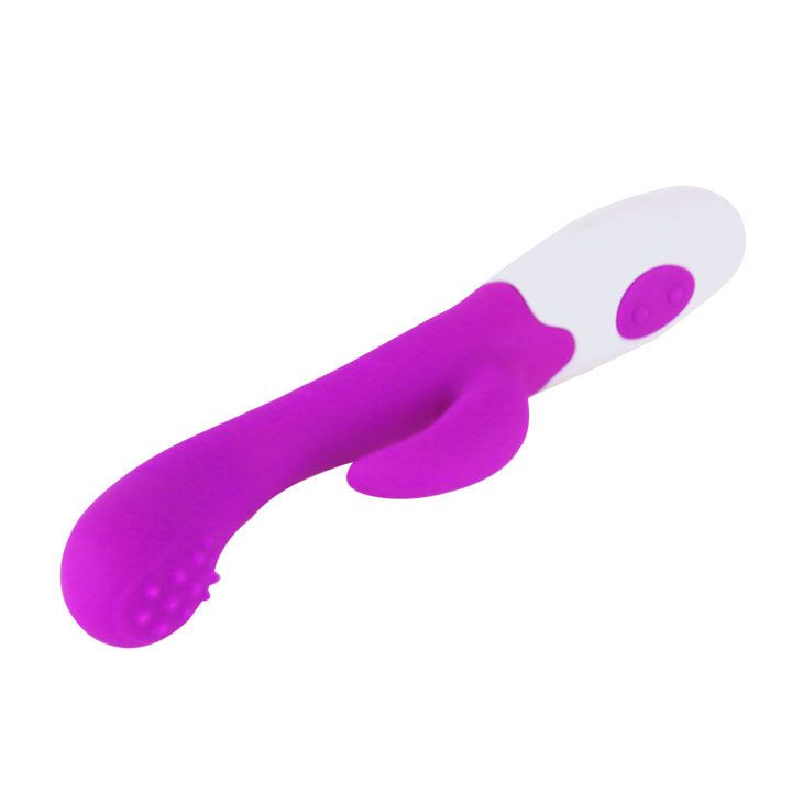 Lila Vibrator mit weißem Griff. Zwei Knöpfe auf dem weißen Teil. Noppen an der Spitze.