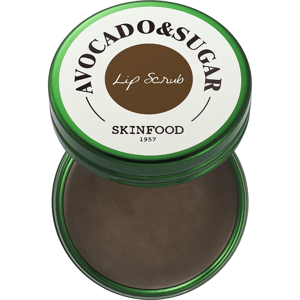 Grüner Behälter, geöffnet. Aufschrift: Avocado & Sugar Lip Scrub, SKINFOOD 1957. Inhalt: brauner Lip Scrub.