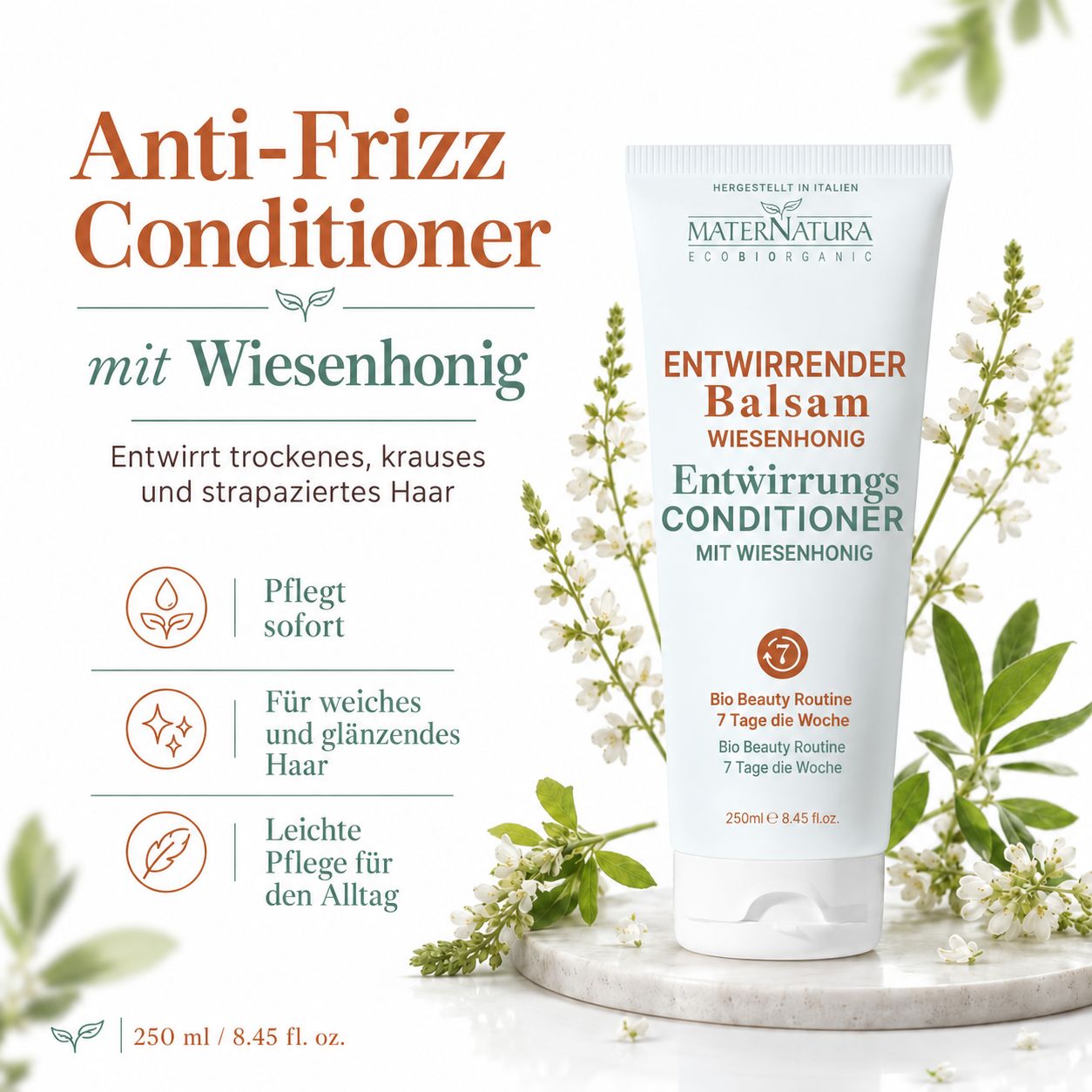 Maternatura Haar Primer mit Goji-Beeren. Weißer Sprühflakon mit orangefarbenem Etikett, gehalten von einer Hand.