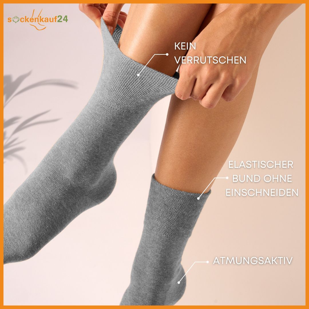 Graue Socken, elastischer Bund ohne Einschneiden, atmungsaktiv. Text: Kein Verrutschen.