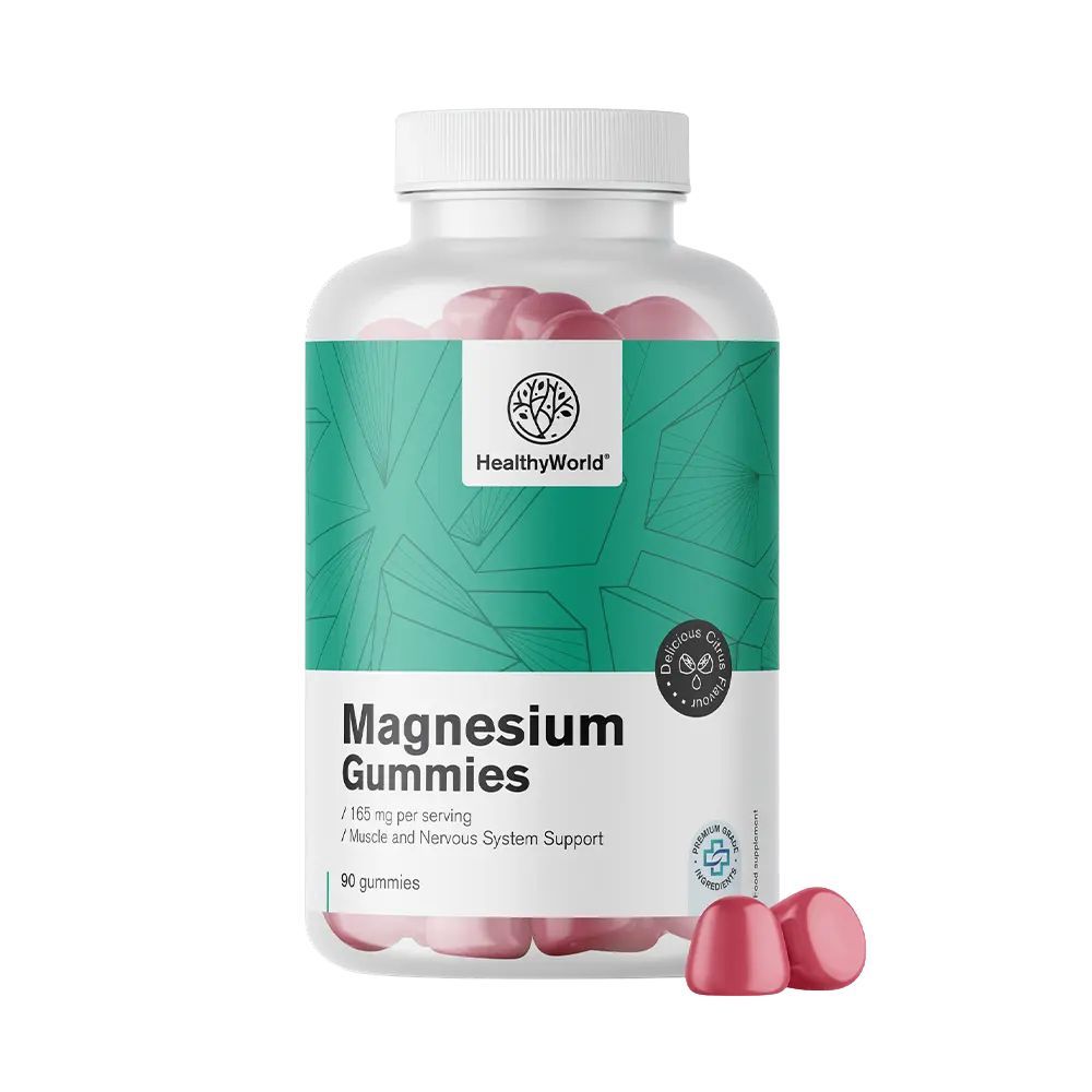 Magnesium Gummies in einer transparenten Flasche. Rote Gummibärchen liegen daneben. Aufschrift: Magnesium Gummies, 165 mg.