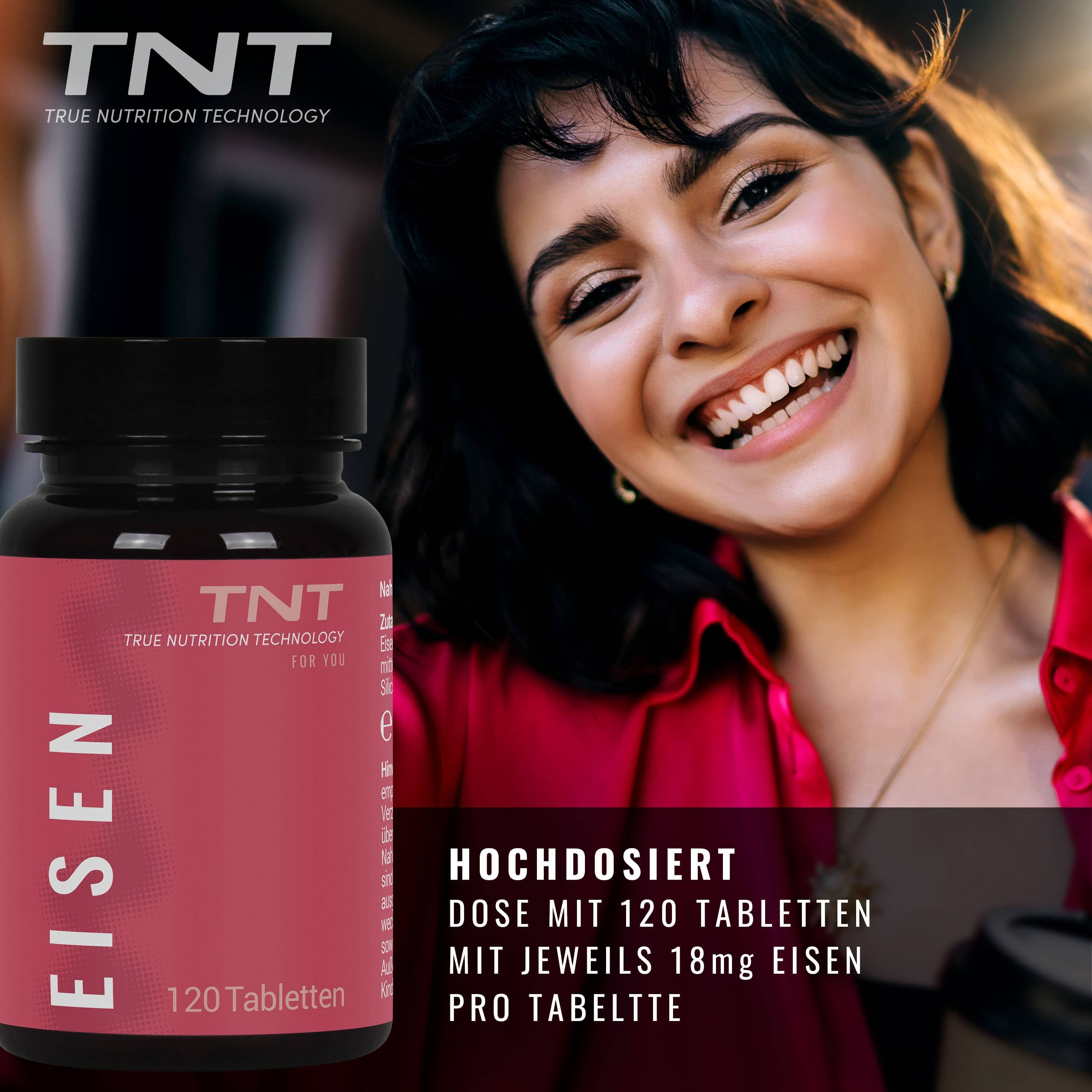 TNT Eisen-Tabletten in einer schwarzen Flasche. Rotes Etikett mit Produktinformationen. Eine lächelnde Frau im Hintergrund.