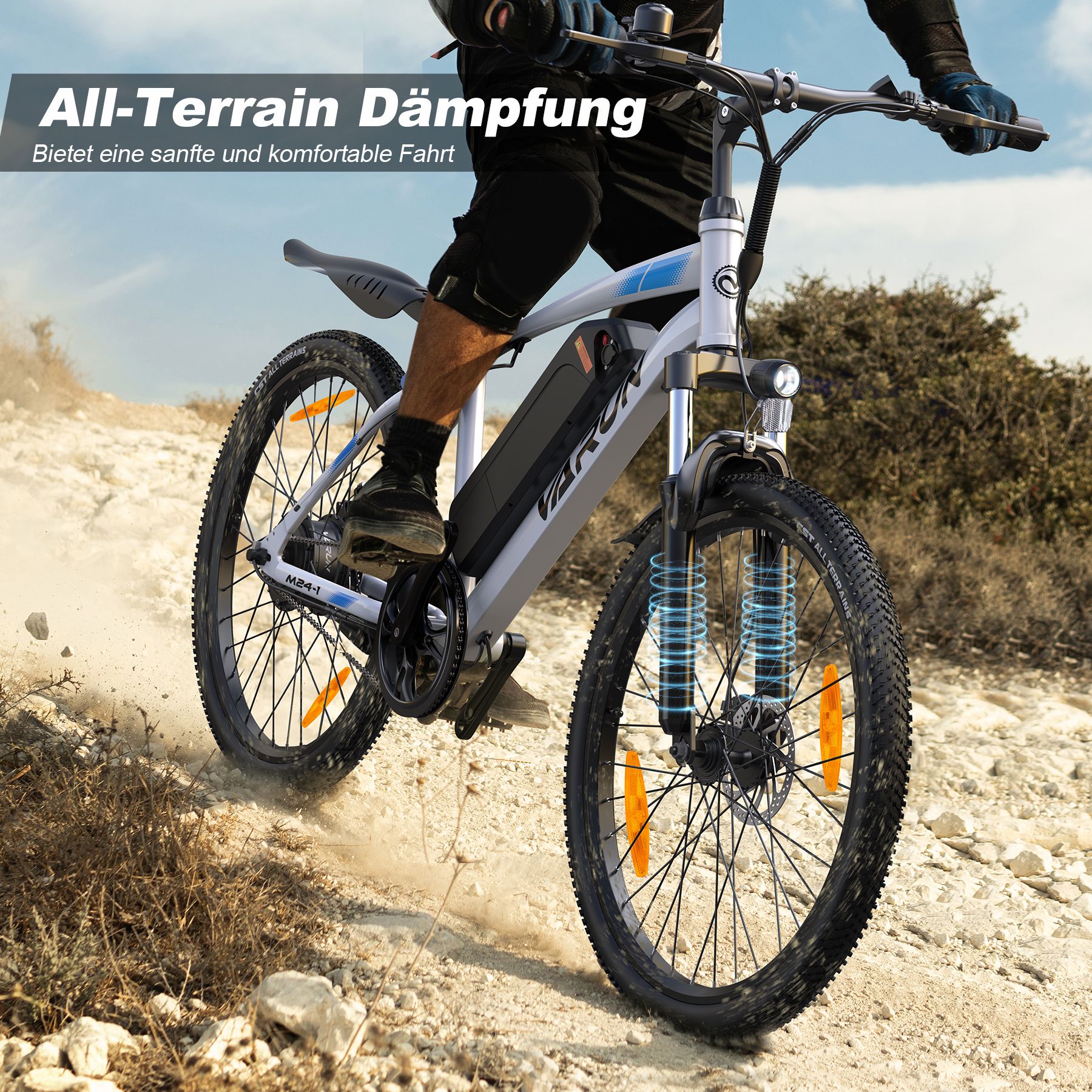 E-Bike fährt auf unebenem Gelände. All-Terrain-Dämpfung. Weißes E-Bike mit schwarzen Komponenten. Fahrer.