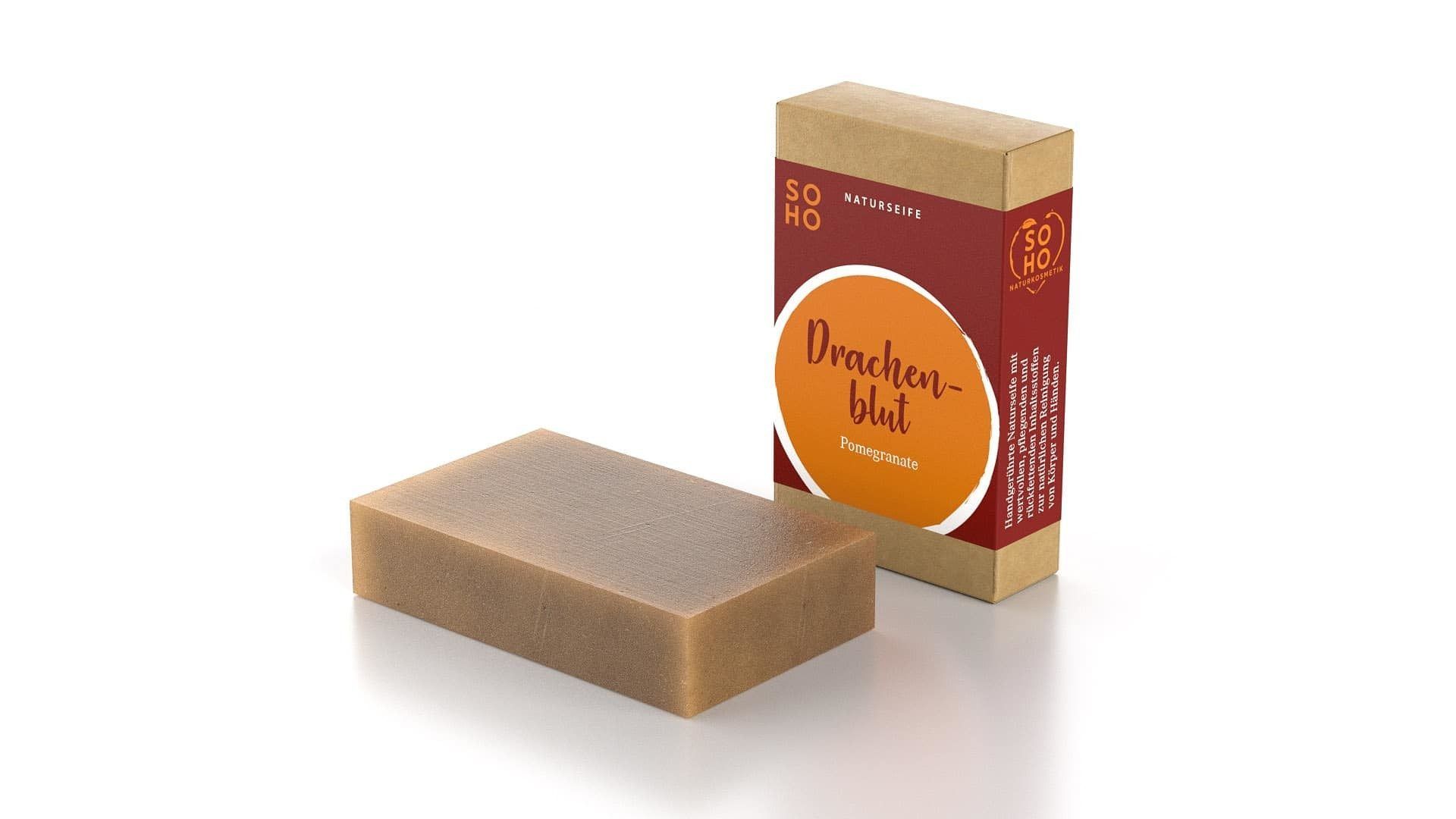 Duschseife und Verpackung. Rechteckige Seife, braun. Karton mit rotem Label und Schriftzug.