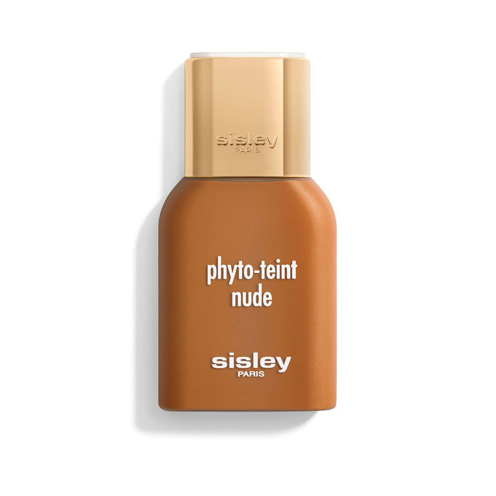Flüssiges Make-up in einer braunen Flasche mit goldenem Deckel. Aufschrift: phyto-teint nude, sisley paris.