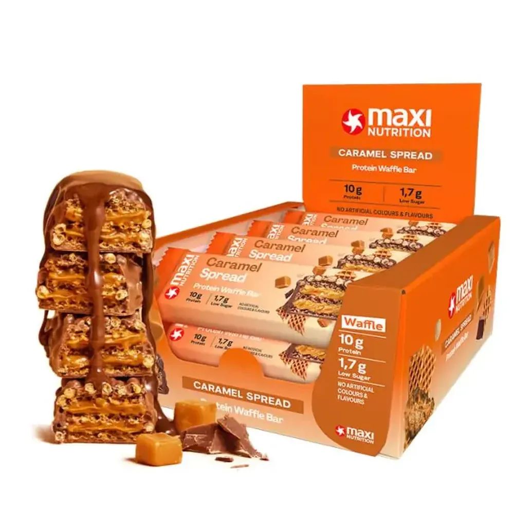 Verpackung mit Protein Waffle Bars. Einzelne Waffel mit Karamell-Belag. Aufschrift: Caramel Spread, 10g Protein, 1,7g Zucker.