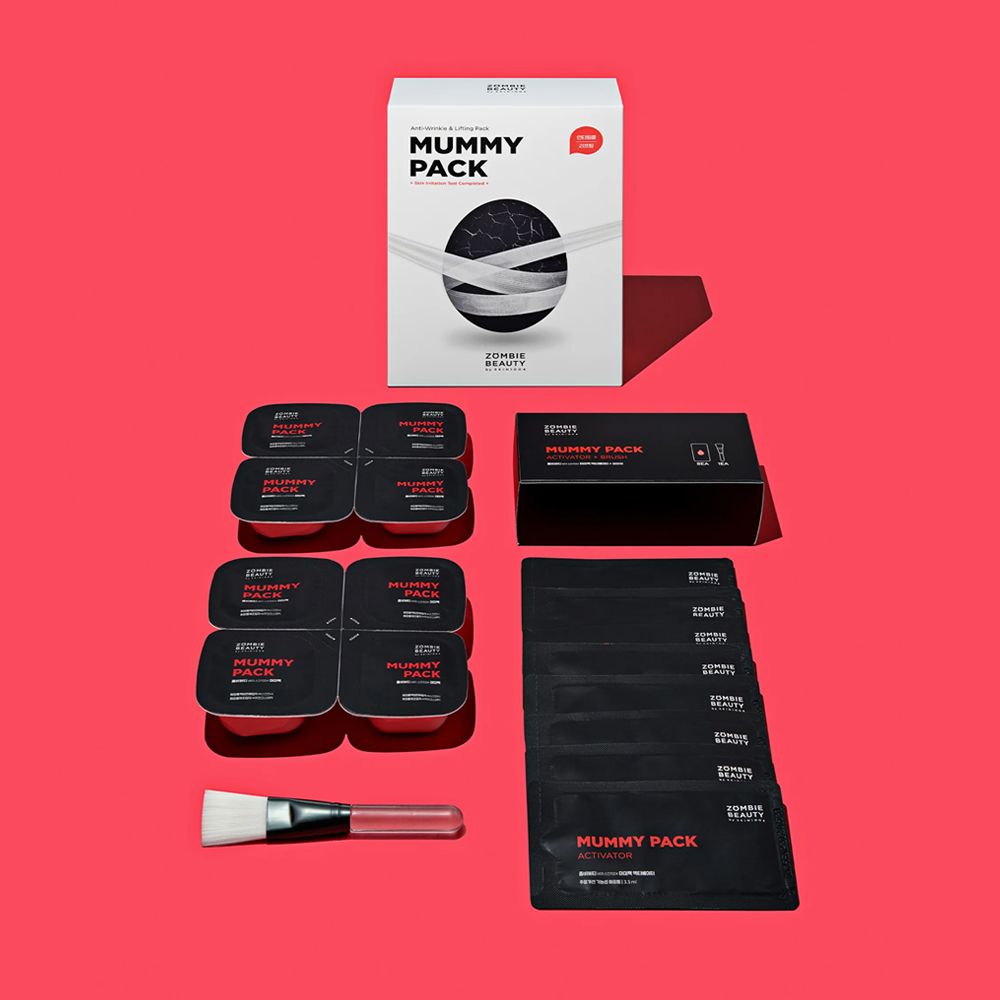 Produktpackung mit mehreren Einzelpackungen, Pinsel und schwarzer Box. Aufdruck: MUMMY PACK.