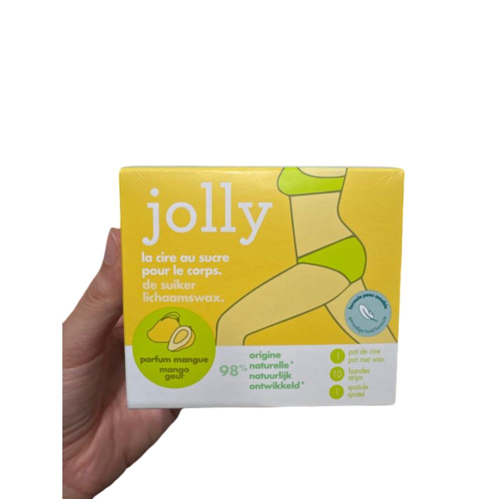 Gelbe Verpackung mit Produktname „jolly“. Abbildung einer Frau. Text: „la cire au sucre pour le corps“. Mango-Duft. 98% natürlich.