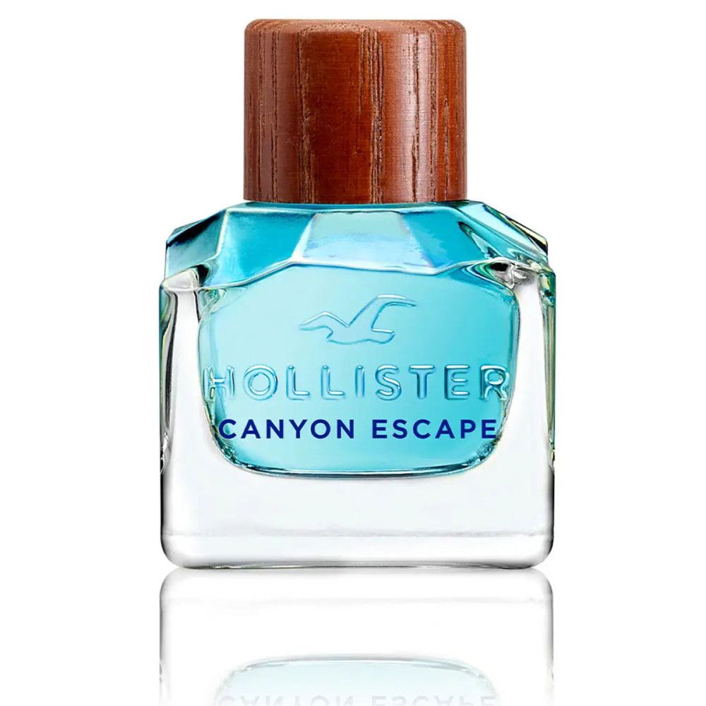 Quadratischer Flakon mit blauem Inhalt und Holzdeckel. Aufschrift: Hollister Canyon Escape.