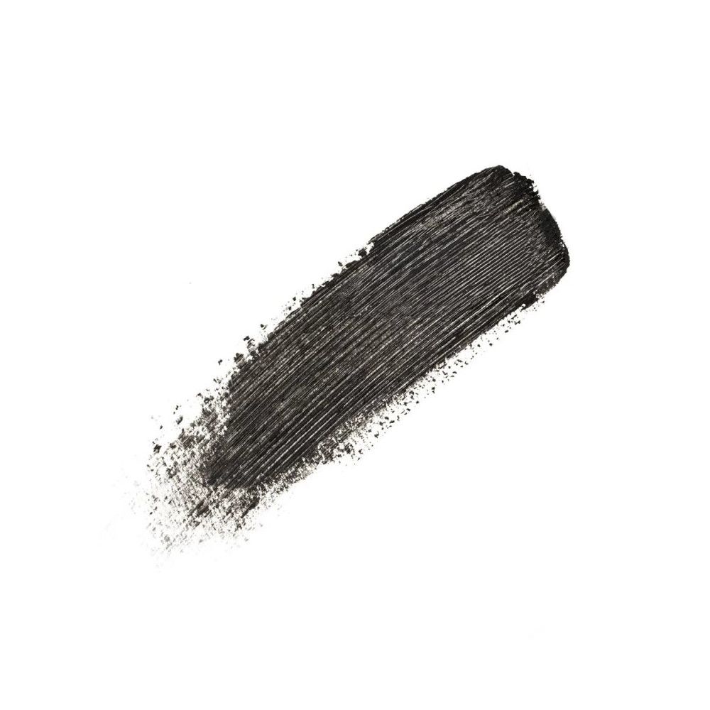 Schwarzer Mascara-Abstrich auf weißem Hintergrund. Textur sichtbar.