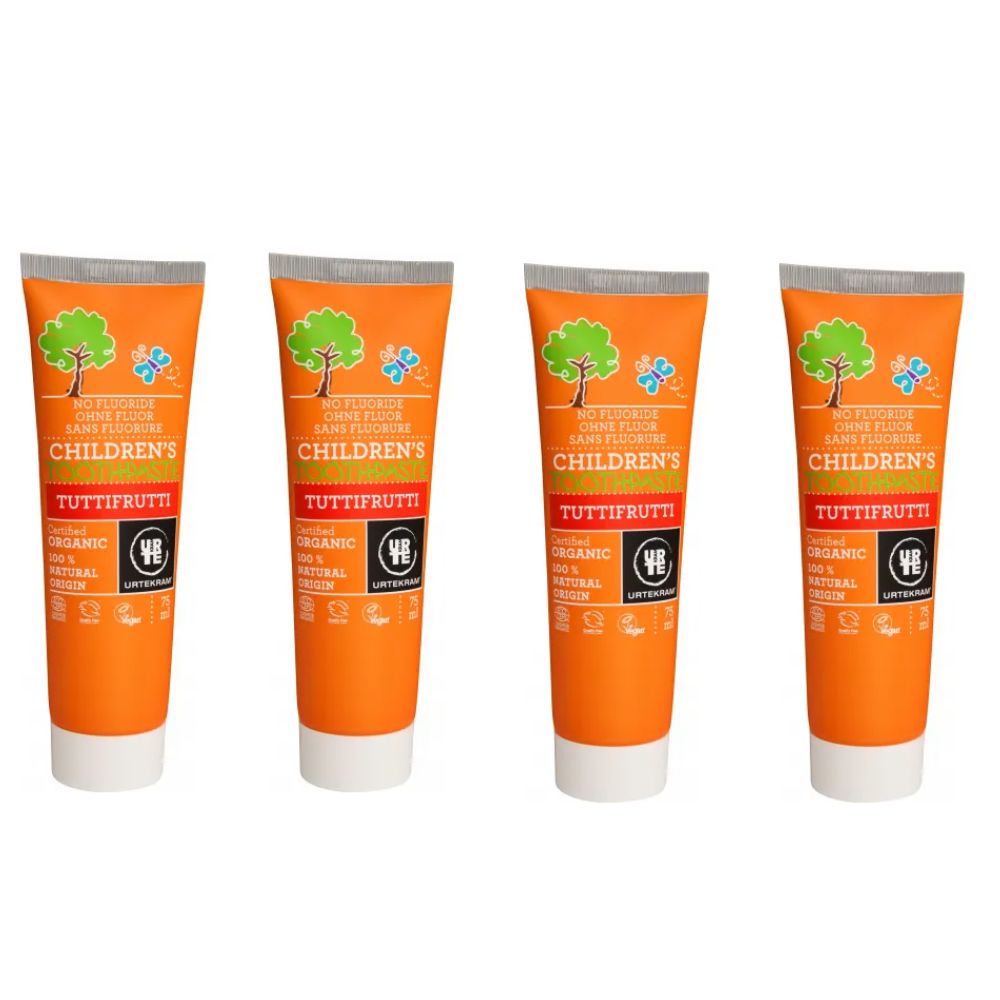 Vier Tuben Kinderzahnpasta Tutti Frutti, orangefarben, mit Baum- und Schmetterlingsmotiv.