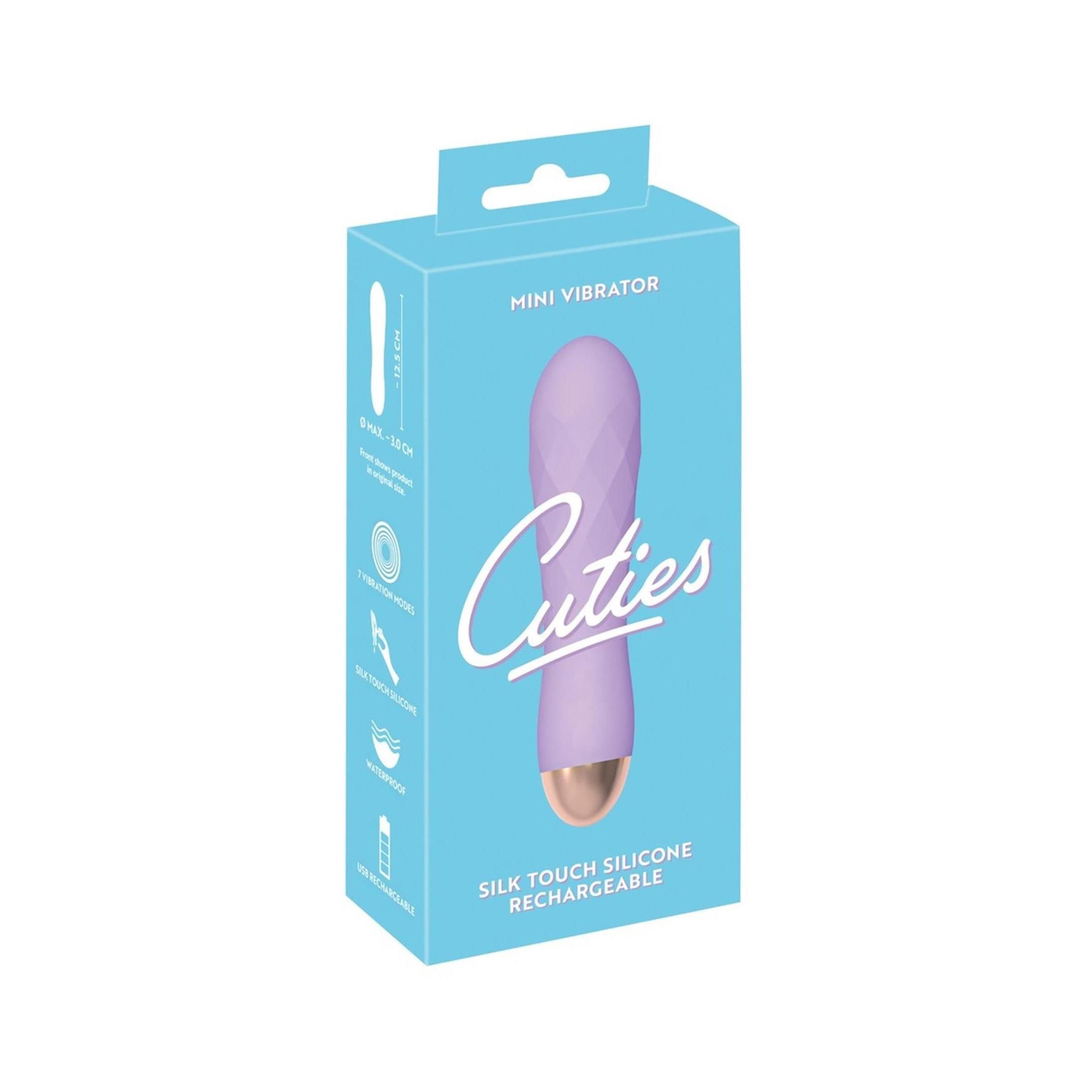Verpackung mit lila Vibrator-Abbildung. Text: Cuties, Mini Vibrator, Silk Touch Silicone, Rechargeable.