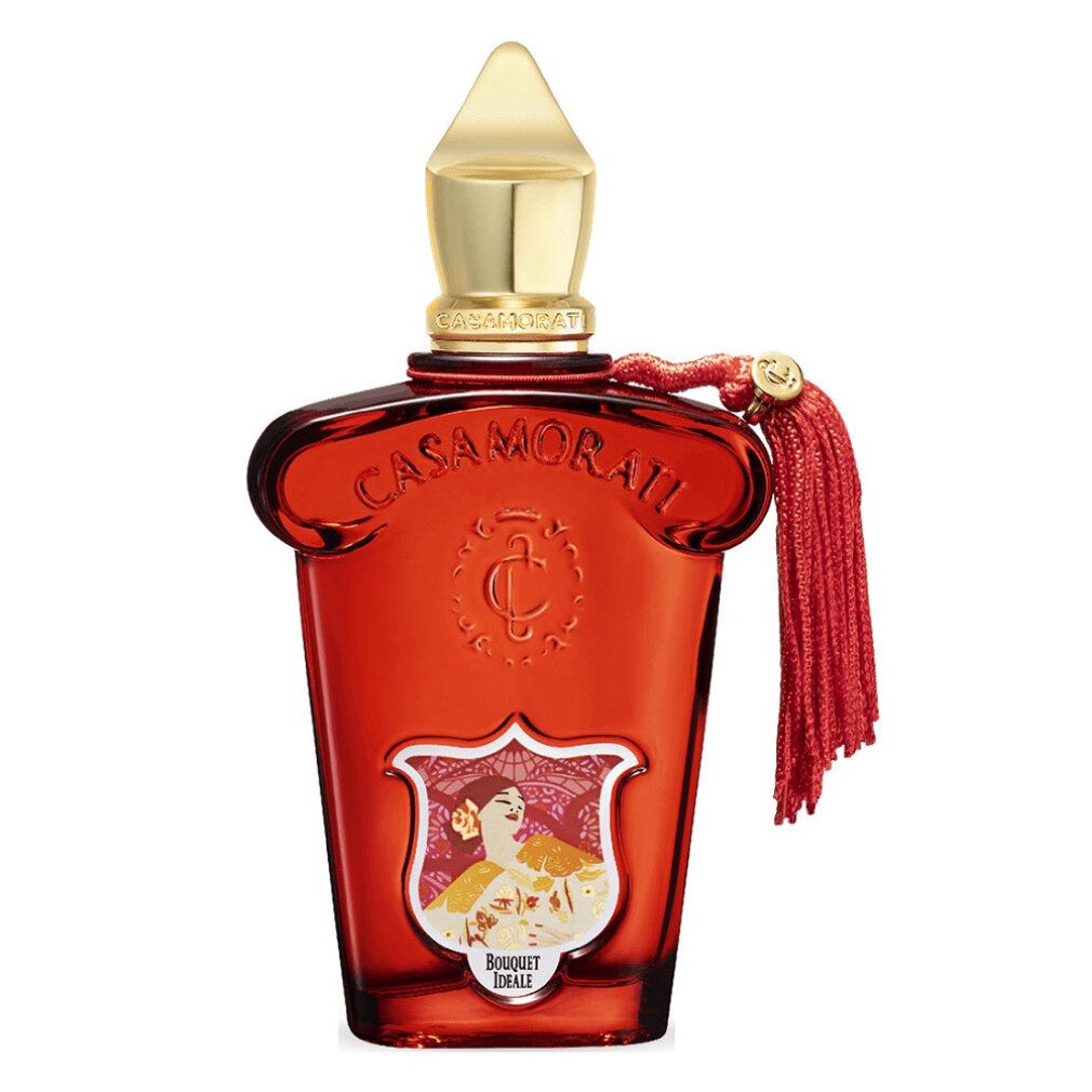 Roter Flakon mit goldfarbenem Verschluss und Quaste. Aufkleber mit floralem Motiv und Schriftzug.