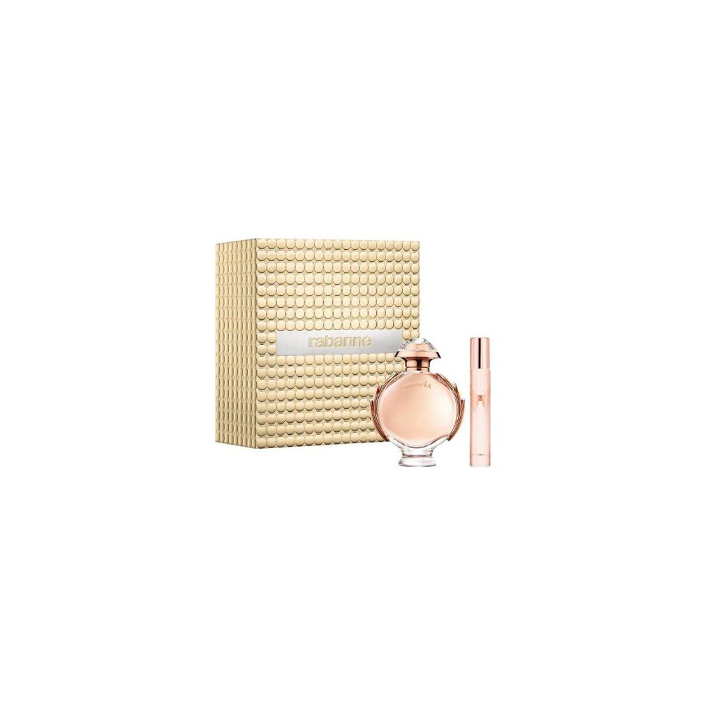 Paco Rabanne Olympea Giftset: Parfümflakon und Reisezerstäuber neben goldener Geschenkbox mit Rautenmuster.